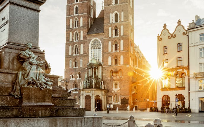 St. Mary's Basilica and Adam Mickiewicz Monument in Krakow's Main Square during a guided walking tour.