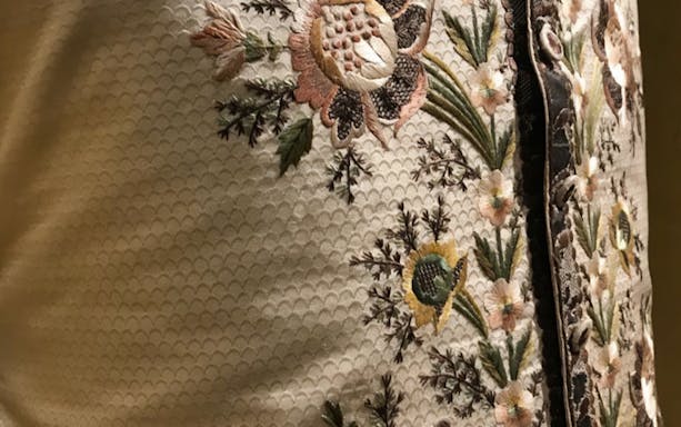 Embroidered floral pattern on historical garment at Mocenigo Palace-Museum.