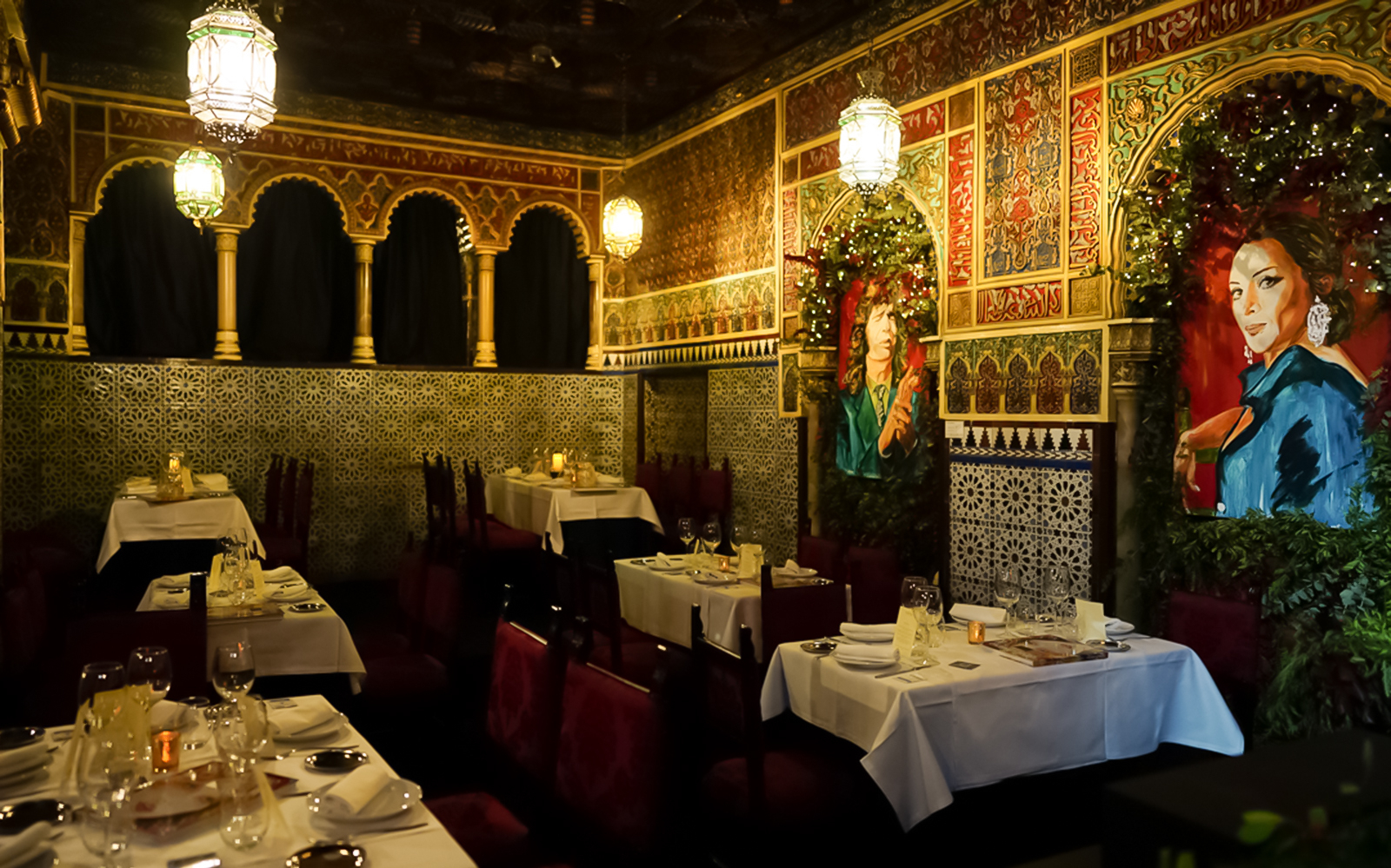 Elegant dining room with ornate decor and flamenco-themed artwork, part of the Royal Madrid Palace Tour.