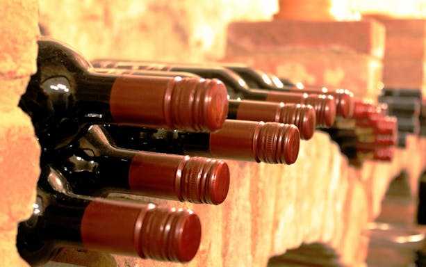 Wine bottles in a cellar during Toledo tour from Madrid.