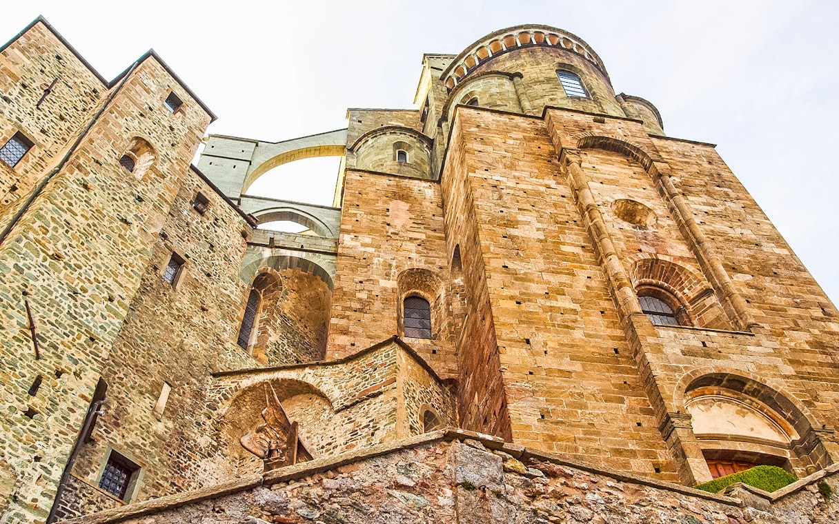 Sacra di San Michele stone facade on a half-day tour from Torino.