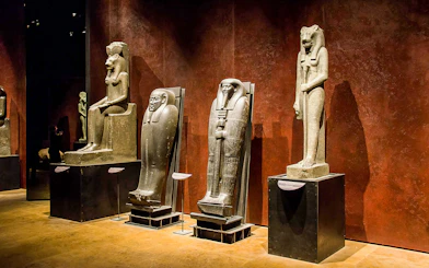 Ancient Egyptian statues displayed at the Egyptian Museum of Turin.