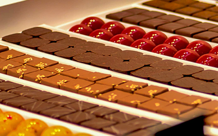 Assorted chocolates and pralines on display in a Turin confectionery shop.
