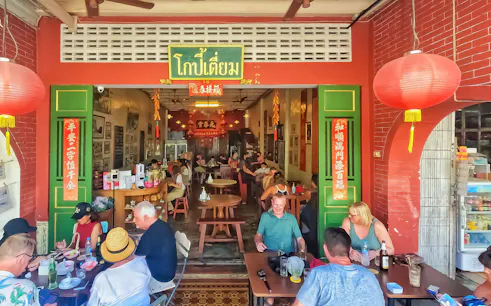 Outdoor dining at a traditional restaurant in Phuket during a Michelin food tour.