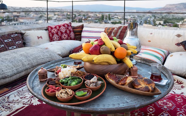 Traditional Turkish breakfast spread on a rooftop terrace in Cappadocia.