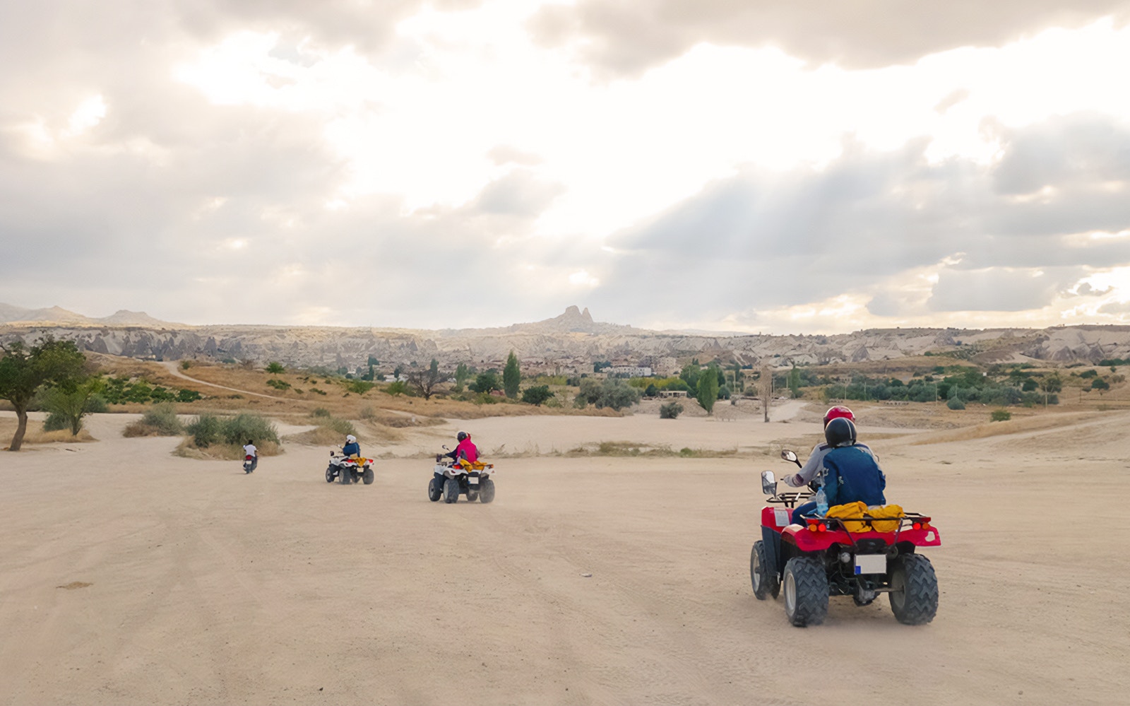 ATVs driving through Cappadocia's unique landscape during a safari tour.