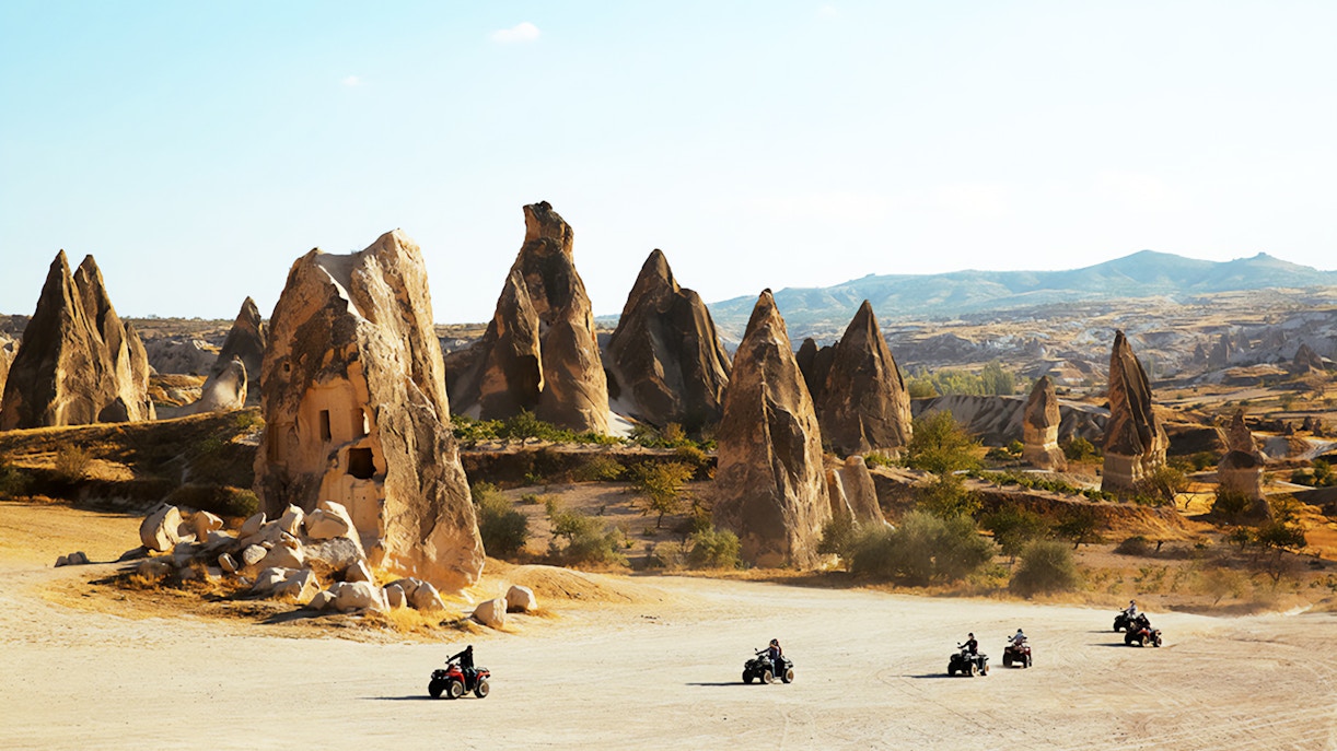 ATVs driving through Cappadocia's unique rock formations.