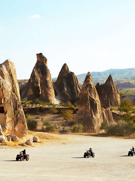 ATVs driving through Cappadocia's unique rock formations.