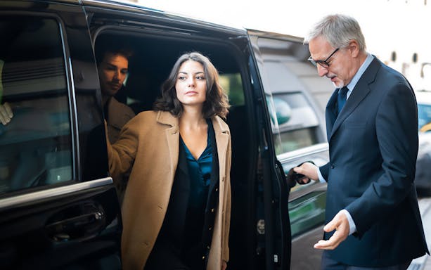 Passenger exiting a shuttle at Cappadocia airport transfer service.