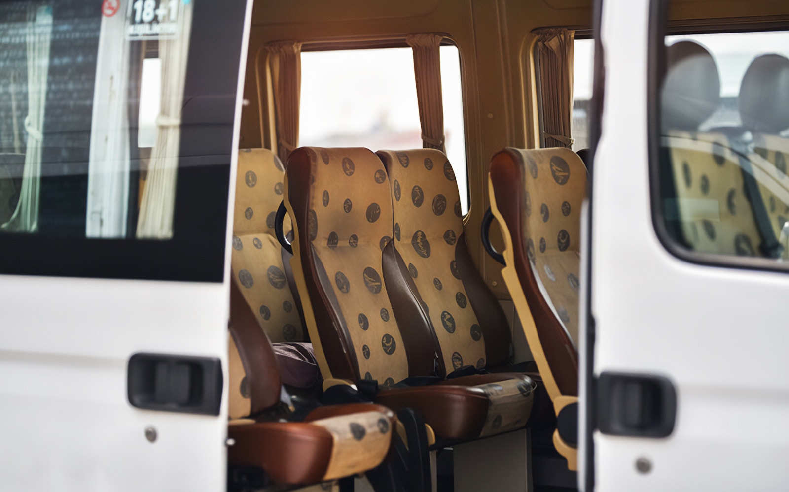 Cappadocia airport shuttle interior with passenger seats.