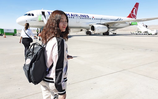 Traveler boarding Turkish Airlines flight for Cappadocia tour from Istanbul.