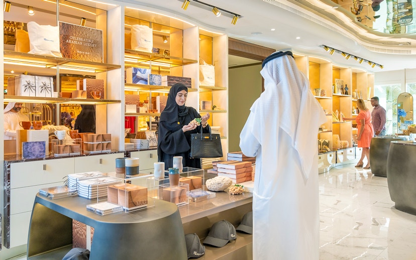 Guests exploring a gift shop during a guided tour inside Burj Al Arab, Dubai.