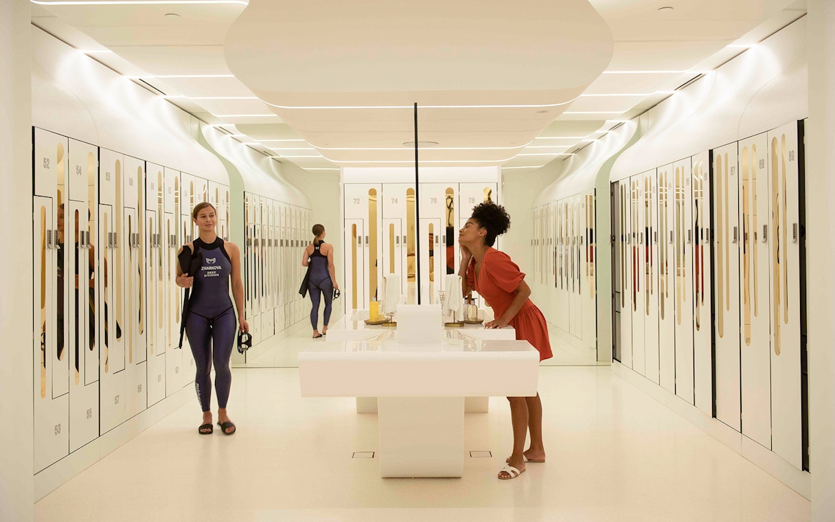 Snorkelers preparing in Deep Dive Dubai locker room.