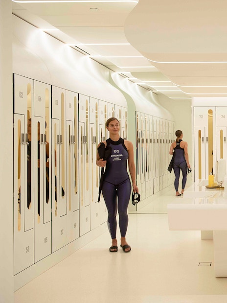 Snorkelers preparing in Deep Dive Dubai locker room.