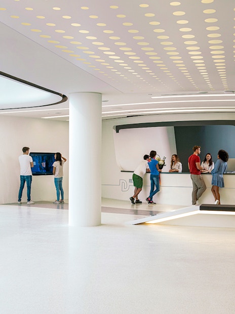 Visitors at Deep Dive Dubai's modern reception area.