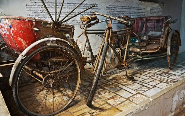 Vintage rickshaw display at Erawan National Park, Thailand, part of the Erawan Waterfall tour.