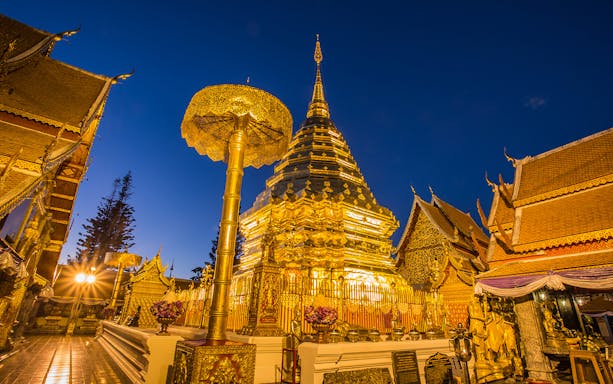 Golden pagoda at Wat Phra That Doi Suthep during sunrise, Chiang Mai, Thailand.