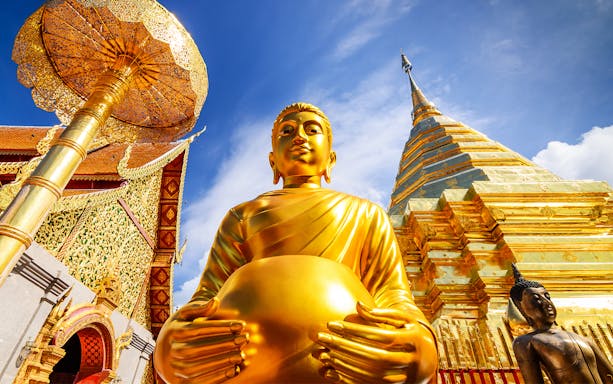 Wat Umong and Doi Suthep temples illuminated at dusk, Chiang Mai evening tour.