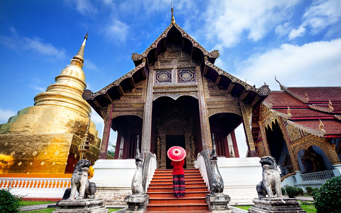 Wat Umong and Doi Suthep temples illuminated at dusk, Chiang Mai evening tour.