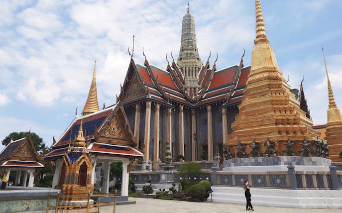 Grand Palace and Wat Phra Kaew with ornate spires in Bangkok, Thailand.