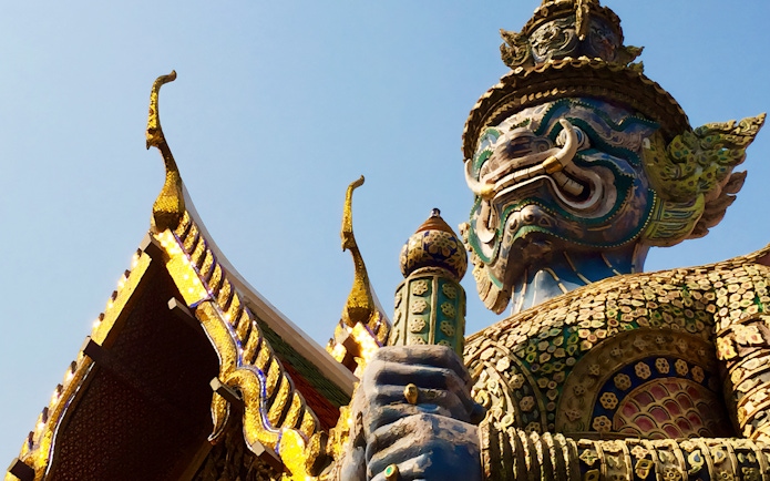 Giant guardian statue at Wat Phra Kaew, Bangkok, during Grand Palace walking tour.