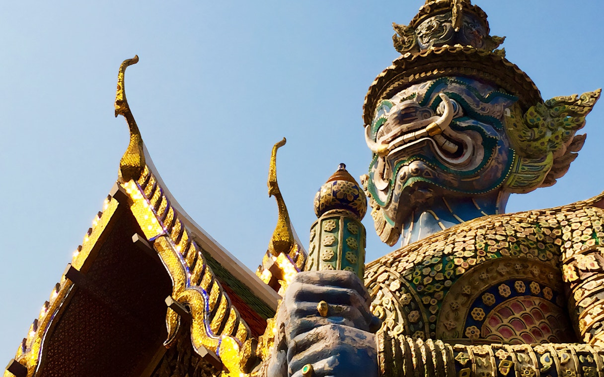 Giant guardian statue at Wat Phra Kaew, Bangkok, during Grand Palace walking tour.