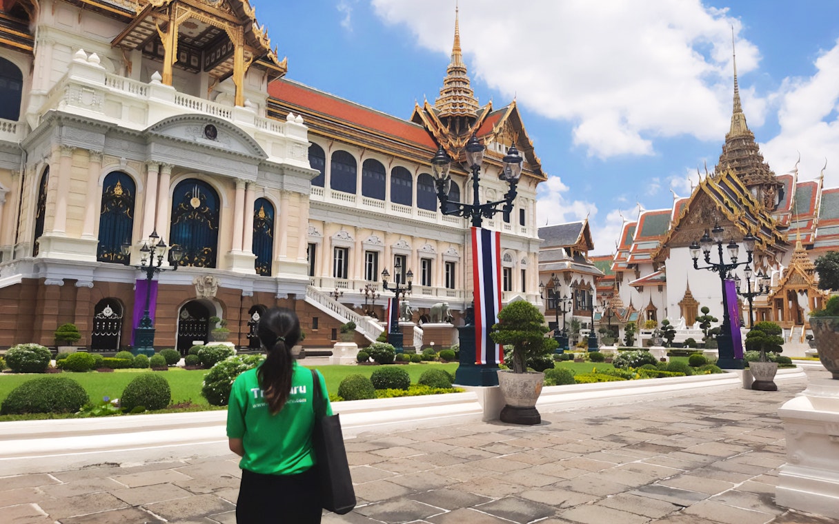 Grand Palace and Wat Phra Kaew with visitor on walking tour in Bangkok, Thailand.