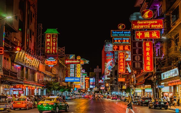 Bangkok Chinatown vibrant street with neon signs and bustling nightlife.