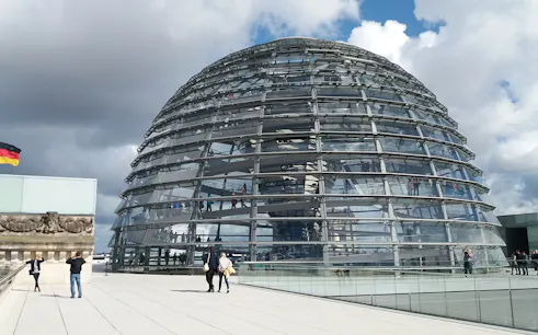 Reichstag Glass Dome with visitors on a multi-lingual private guided tour in Berlin.