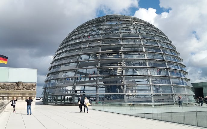Reichstag Glass Dome with visitors on a multi-lingual private guided tour in Berlin.