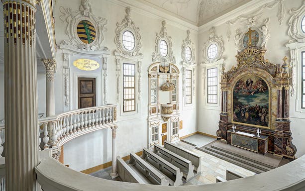 Interior of Moritzburg Castle chapel with ornate altar and pews, part of the Dresden to Meissen tour.