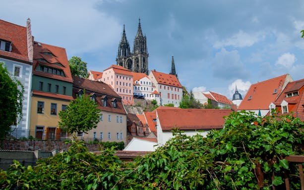 Colorful historic buildings and cathedral spires in Dresden, Germany.