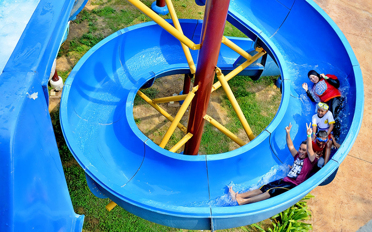 Visitors enjoying a water slide at Bayou Lagoon Water Park.