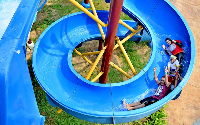 Visitors enjoying a water slide at Bayou Lagoon Water Park.