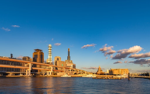 Skyline of Osaka with modern buildings and waterfront, viewable with Hanshin 1-day Tourist Pass.