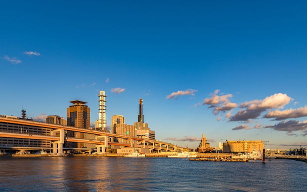 Skyline of Osaka with modern buildings and waterfront, viewable with Hanshin 1-day Tourist Pass.