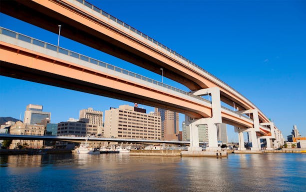 Elevated highway over water in Osaka, Japan, part of Hanshin 1-day Tourist Pass route.
