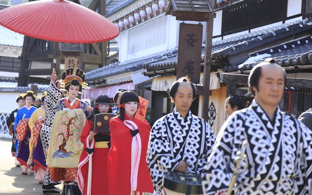 Traditional parade at Edo Wonderland, Japan, featuring participants in historical costumes.