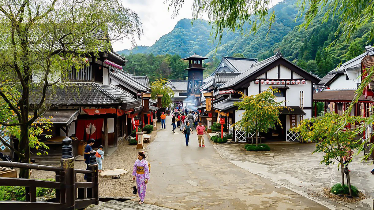 Visitors exploring traditional Edo-period village at Edo Wonderland, Japan.