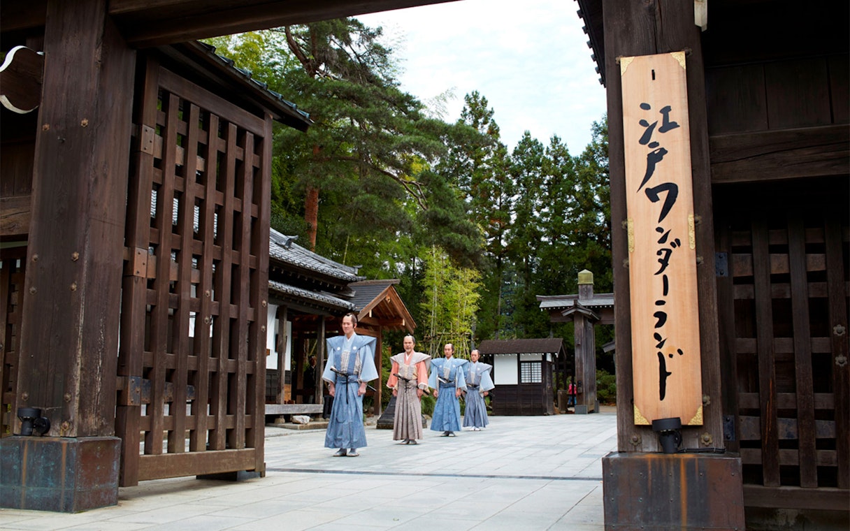 Samurai actors walking through Edo Wonderland entrance in Nikko, Japan.