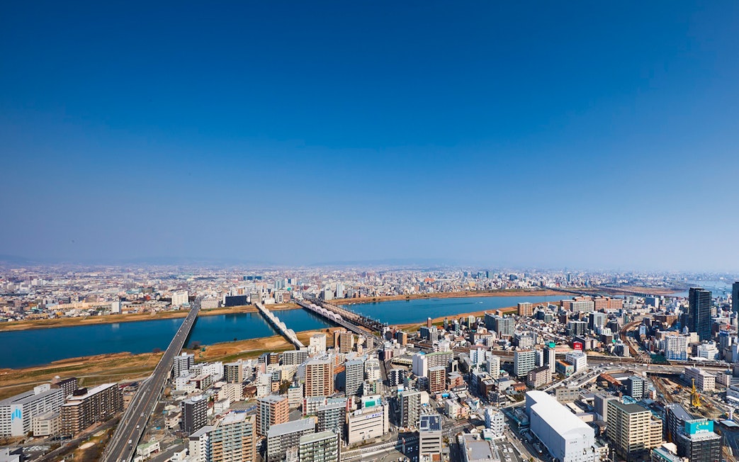 Aerial view of Osaka cityscape with Yodo River, seen from Umeda Sky Building.