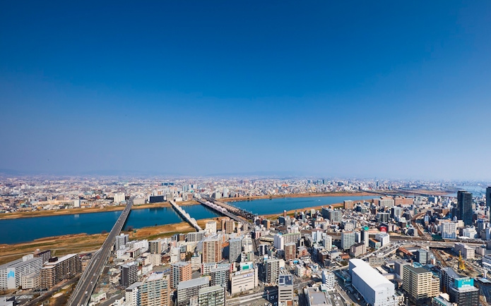 Aerial view of Osaka cityscape with Yodo River, seen from Umeda Sky Building.