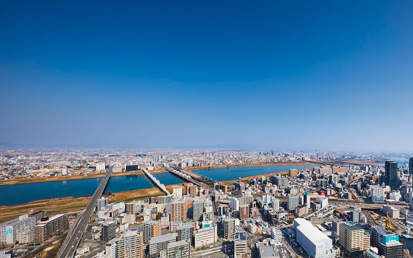 Aerial view of Osaka cityscape with Yodo River, seen from Umeda Sky Building.