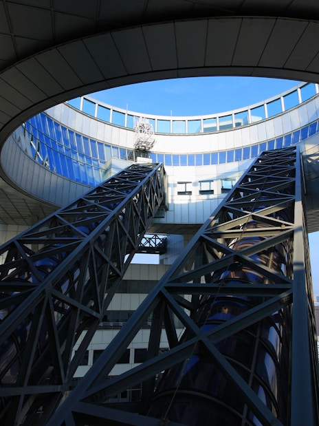 Umeda Sky Building escalators with Osaka cityscape in the background.