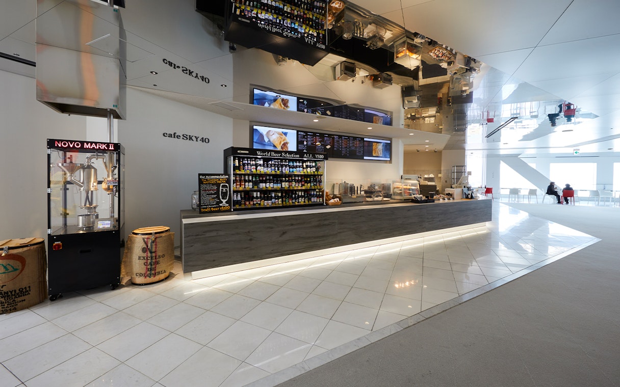 Cafe Sky 40 counter with beverage selection at Umeda Sky Building, Osaka.