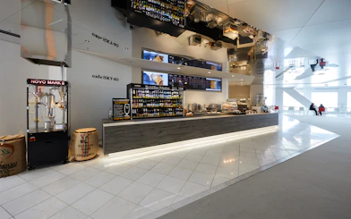 Cafe Sky 40 counter with beverage selection at Umeda Sky Building, Osaka.