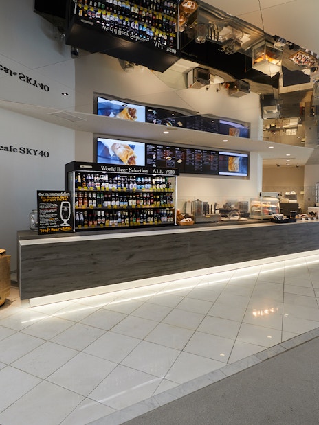 Cafe Sky 40 counter with beverage selection at Umeda Sky Building, Osaka.