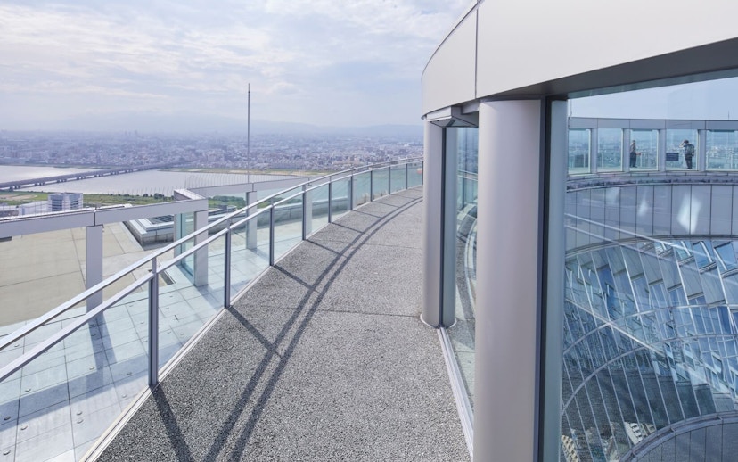 Observation deck view at Umeda Sky Building, Osaka, overlooking cityscape and river.