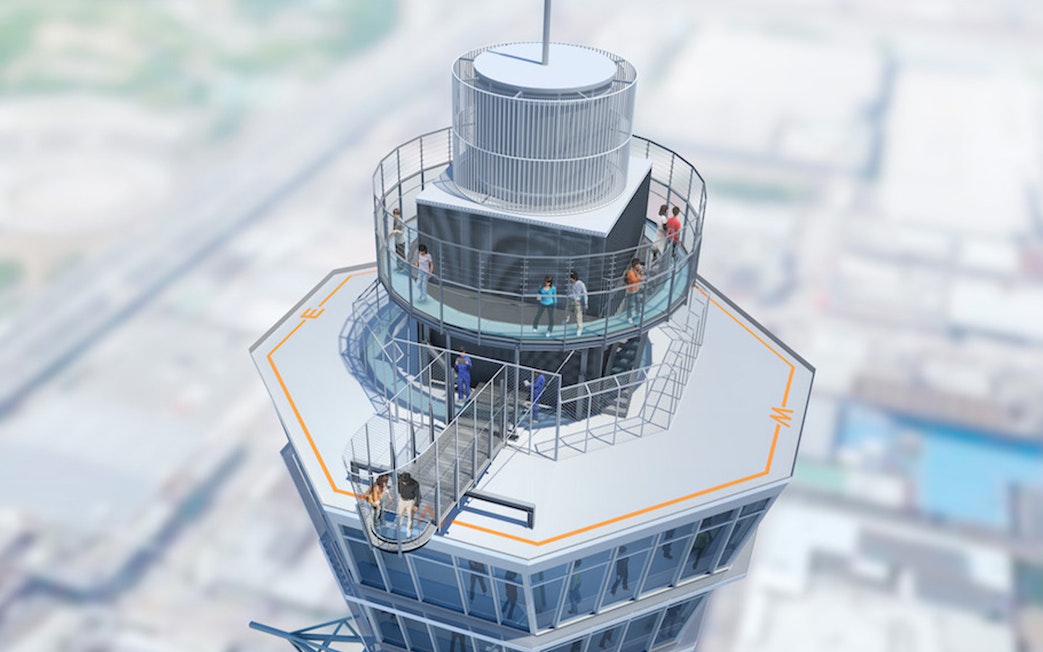 Visitors on the observation deck of Tsutenkaku Tower, Osaka, Japan.