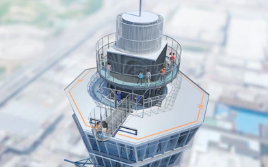 Visitors on the observation deck of Tsutenkaku Tower, Osaka, Japan.